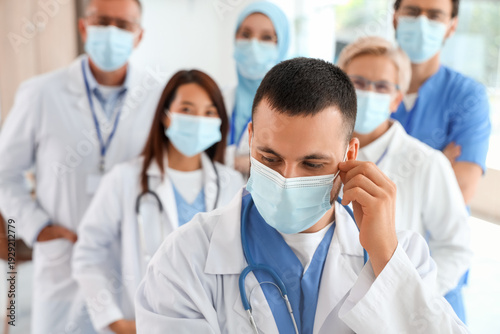 Male doctor with his collea...