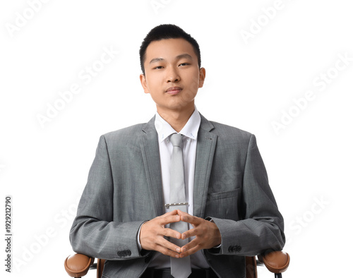 Chinese businessman sitting...