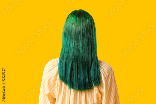 Young woman with green hair...