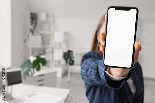 Young woman holding mobile ...