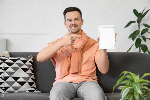 Man with tablet computer si...