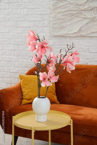 Vase with magnolia flowers ...