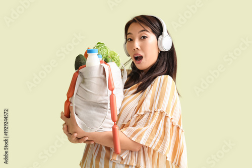 Surprised young Asian woman...