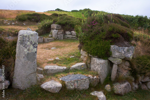 The entrance to an Iron Age round-house with prominent door posts, in the ancient village  on Halangy Down, St. Mary's, Isles of Scilly, UK