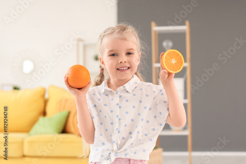 Cute little girl with orang...