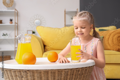 Cute little girl with orang...