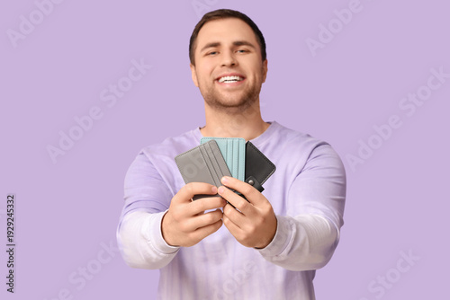 Young happy man with wallet...