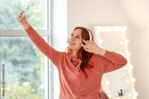 Young woman in headphones w...