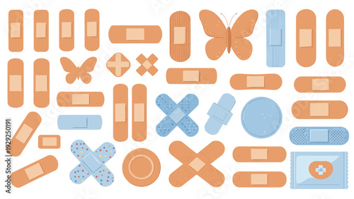 Large assortment of adhesive bandages and medical plasters in various shapes and sizes are displayed for first aid and healthcare.