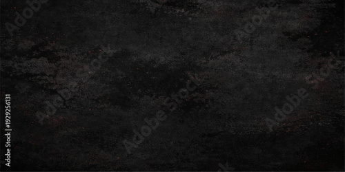 A dark grunge concrete wall with a rough textured backdrop