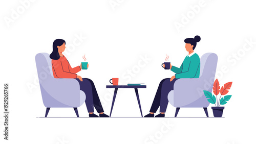 Two female friends sitting in plush armchairs and enjoying a conversation over hot cups of coffee in a cozy indoor setting with a plant.
