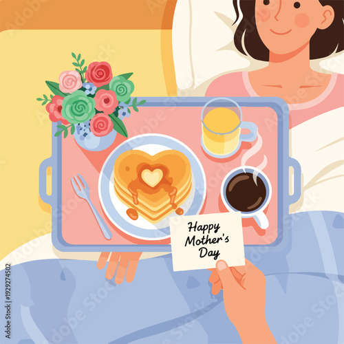 A woman in bed receives a breakfast tray for Mother's Day, happy