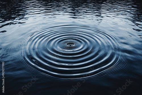 Mesmerizing Close-Up of Water Surface with Ripples and Reflections Created by a Single Drop Impact
