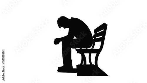Silhouette of a lonely and deeply troubled man sitting slumped over on an empty park bench symbolizing despair and isolation