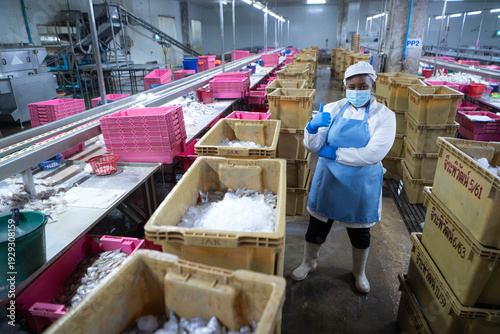 Wallpaper Mural Portrait of seafood factory supervisor overseeing fish sorting Torontodigital.ca