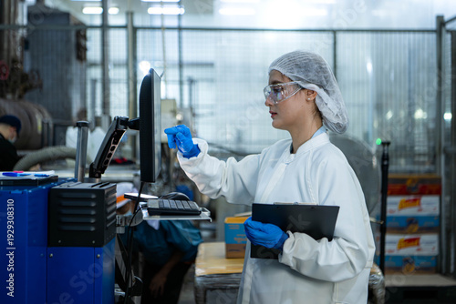 Wallpaper Mural Food scientist inspecting canned fish production line Torontodigital.ca