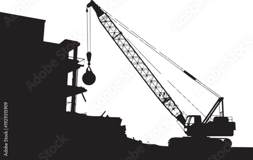 Black silhouette of a crane lifting heavy next to building