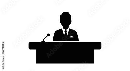 Businessman Standing at Podium with Microphone.