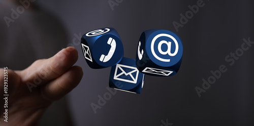 Hand holding contact cube w...