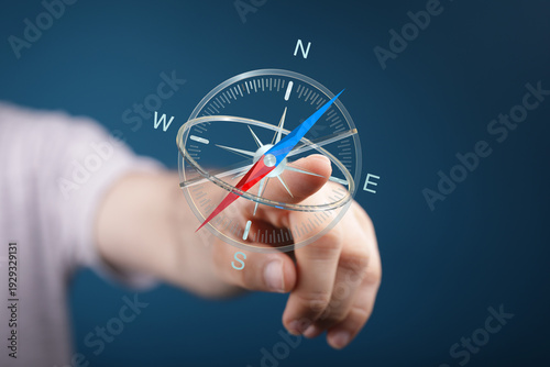 Hand touching a digital com...