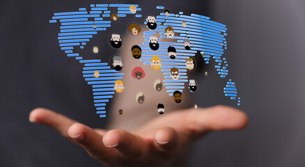 Concept of global connection and social diversity. Hand holding a digital world map with community icons.