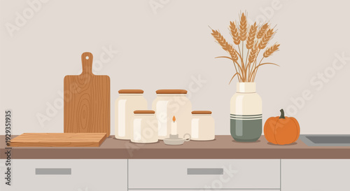 Cozy kitchen countertop with autumnal decorations and cooking essentials.