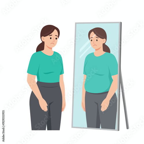 woman with body positivity looking in mirror.