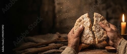 Hands of Jesus Christ Breaking Unleavened Bread at Last Supper with Flying Crumbs and Candlelight - Holy Communion Concept