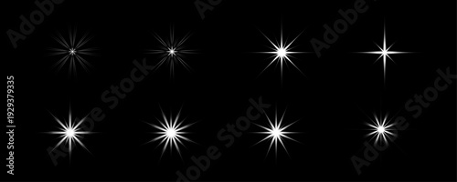 White Starburst Glow Light Effects Set Isolated on Black Background