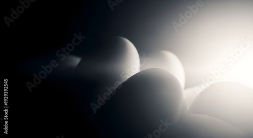 Eggs in a dramatic lighting setup with shadows and highlights