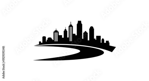 Cityscape silhouette with a winding road in the foreground.