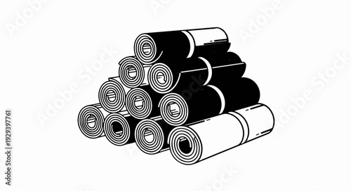 Stacked rolled mats, some black, some white, forming a pyramid shape
