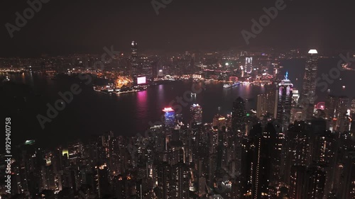 Wallpaper Mural Stunning nighttime aerial view of Hong Kong from Victoria Peak. Captures illuminated skyscrapers, vibrant skyline, and panoramic cityscape from a cinematic elevated perspective. Torontodigital.ca