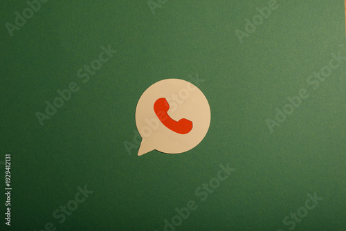 WhatsApp logo on a green ba...