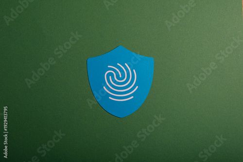 A blue shield featuring a f...