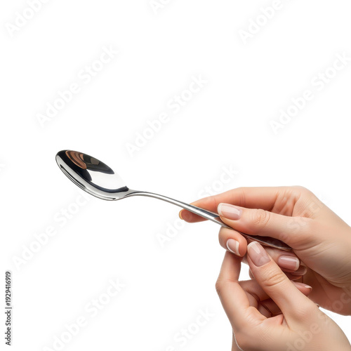 Woman holding a spoon in her hands