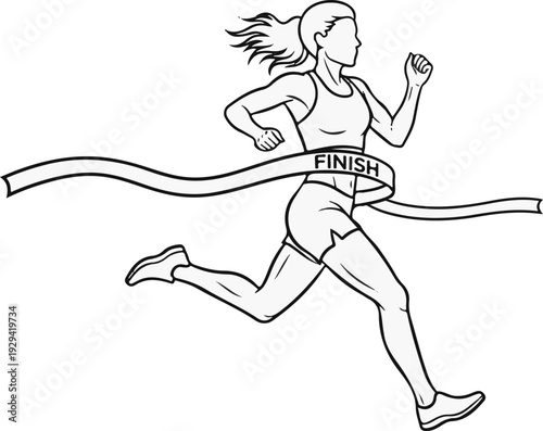 Athletic woman breaks finish line tape in a race with determination