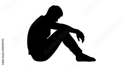 A silhouette of a person sitting on the ground, appearing sad and in despair, isolated on a white background.