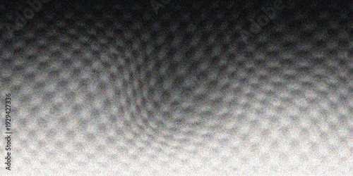 Seamless geometric snake skin texture with a black and white honeycomb pattern featuring a metallic grey hexagon design for a modern technology backdrop