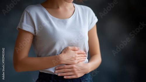 Wallpaper Mural Gut brain connection concept with woman holding abdomen and head simultaneously showing digestive and mental link, perfect for microbiome health, gut health awareness, holistic wellness, modern Torontodigital.ca