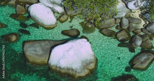 Top Down Aerial of Turquoise Coastal Water and Granite Rocks Belitung Indonesia