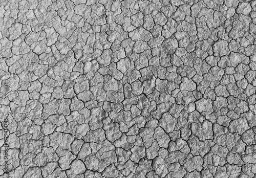 Canvastavla Black and white top view of cracked dry soil texture background,High angle monochrome shot of parched earth with deep cracks