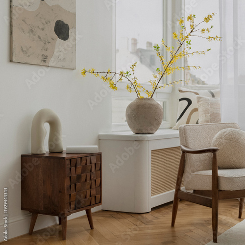 Cozy living room interior with modern furniture, natural light, and elegant decor, displaying warmth and contemporary style