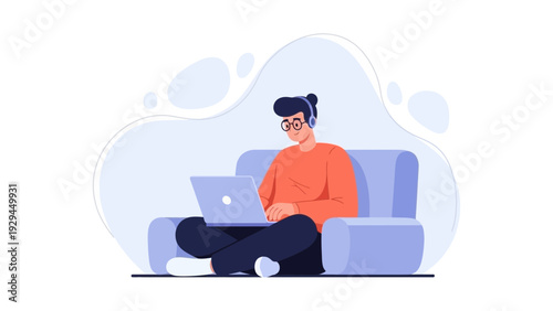 Person working on laptop with headphones on sofa, remote work concept
