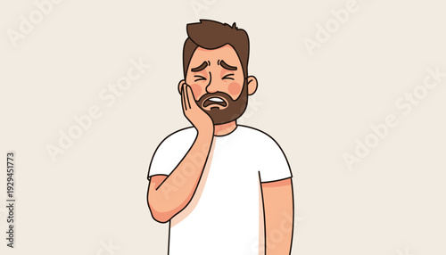 Young man suffering from severe toothache, holding his aching cheek, depicting dental pain.