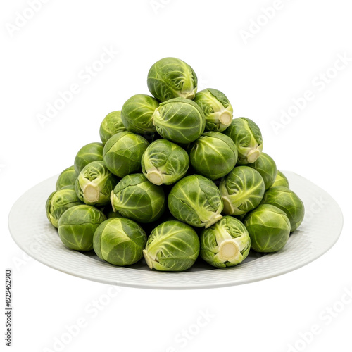 Pile of fresh Brussels sprouts on a white plate