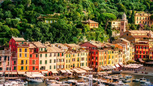 beautiful landscape of luxury resort Portofino in Luguria , Italy.  Sea coast of elite italian resort during sunset or sunrise. Beautiful bay with buildings and green mountain forest.