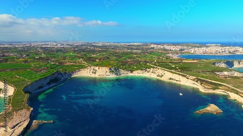 Drone view of Maltese countryside. Cliffs, rocks, sea and green fields. Mediterranean sea