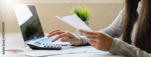 Financial owe, hand of asian woman sitting, holding credit card, stressed by calculate expense from invoice or bill, no money to pay, mortgage or loan