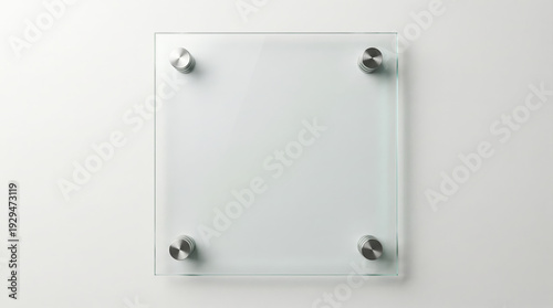 Blank square glass signage plaque mockup with metal standoffs on a white wall for corporate branding.